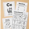 Educational children's worksheets on a wooden surface
